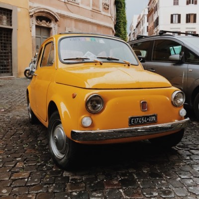 A vintage yellow Fiat. Photo by Mark Neal from Pexels.